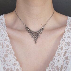 Gothic V-shaped silver waterfall choker necklace with a small silver chain